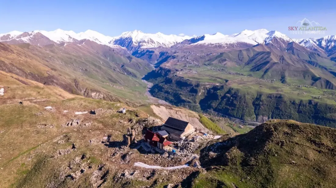 Aerial view of a mountain guesthouse on a private tour